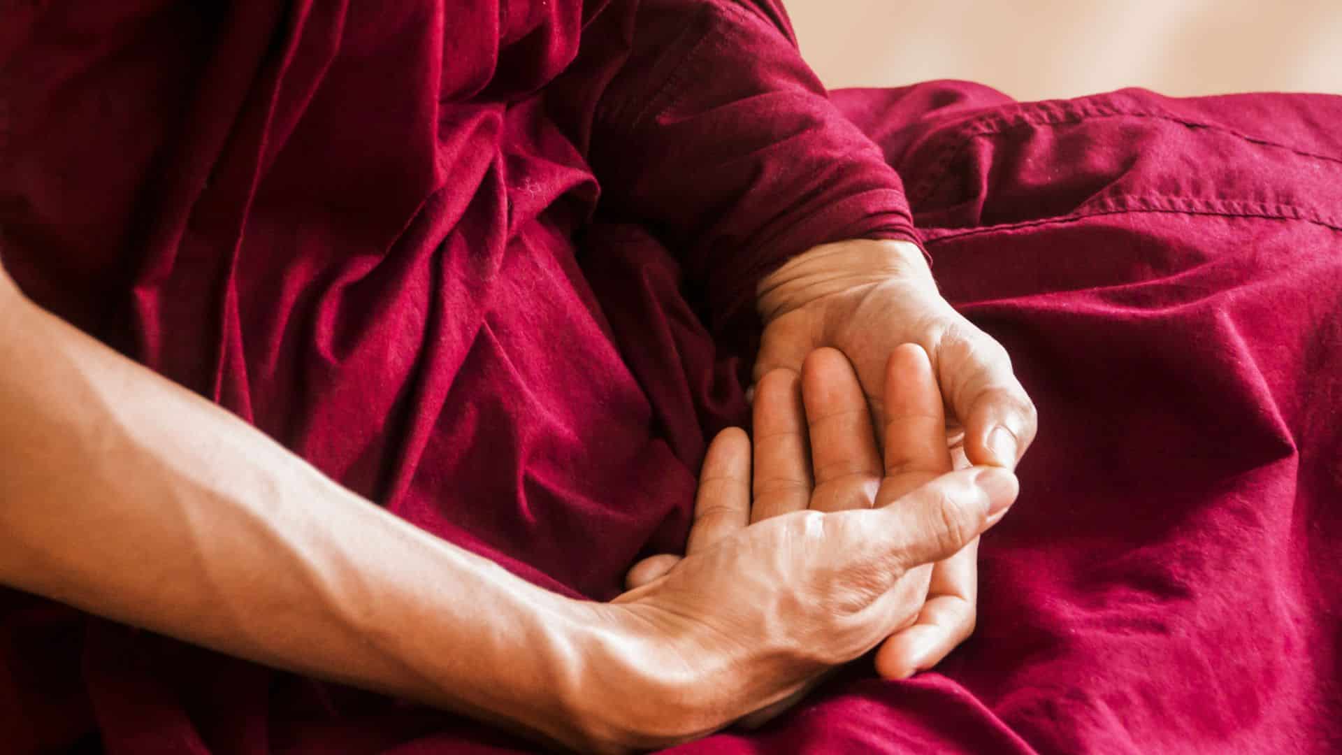 close up of the hands of a person doing shamatha meditation