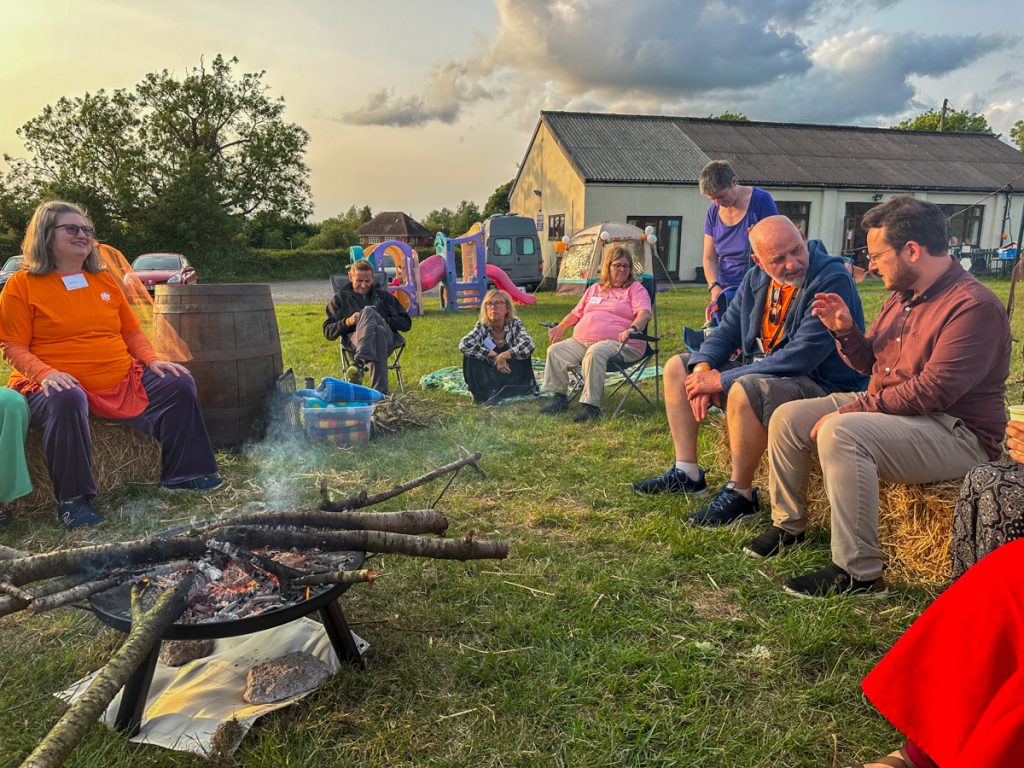The community around the campfire in the evening