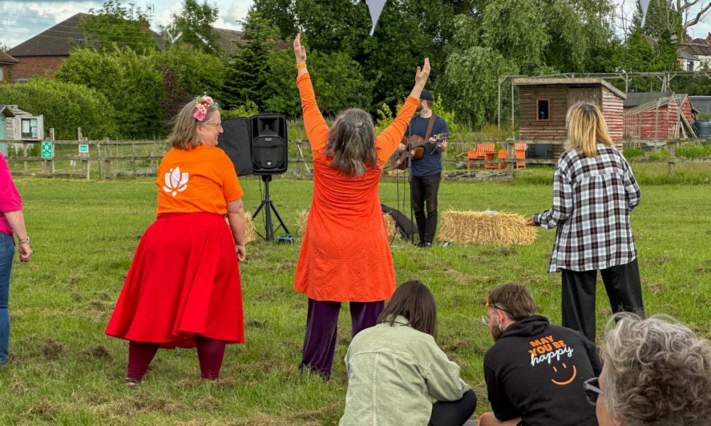 Dancing on the field with arms in the air
