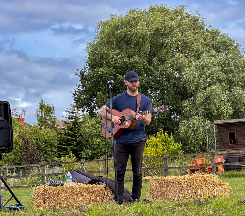 Live acoustic music beside the hay bales