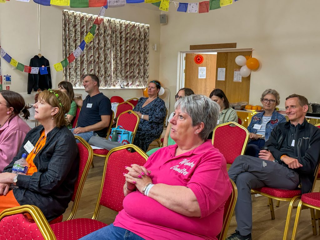 The audience listening to a talk in the main hall