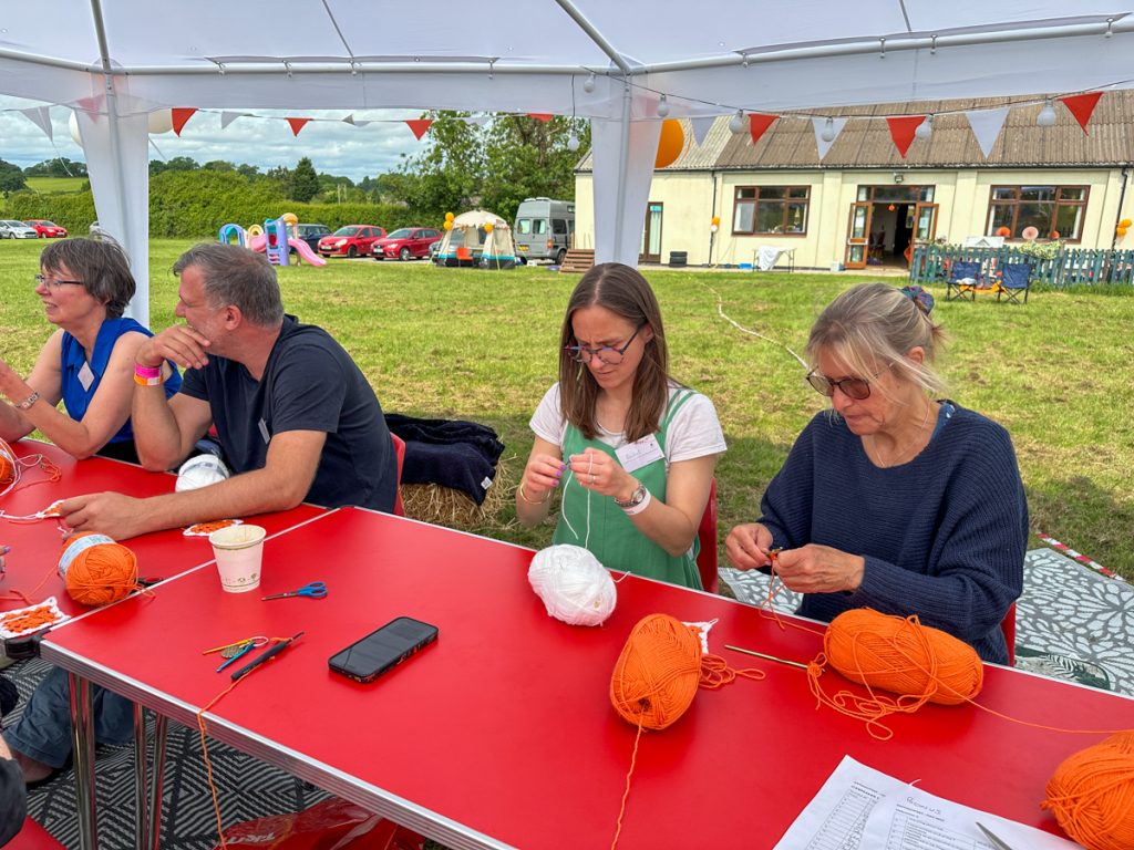 Crochet workshop around the red table