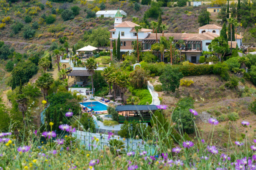 Santillan and its gardens seen across the valley