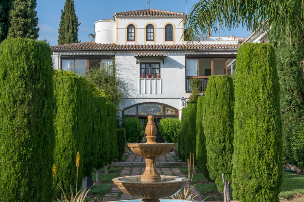 Fountain and cypresses in the garden