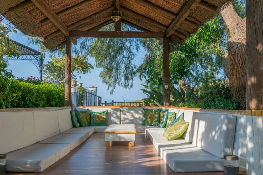 Thatched lounge gazebo looking to the sea