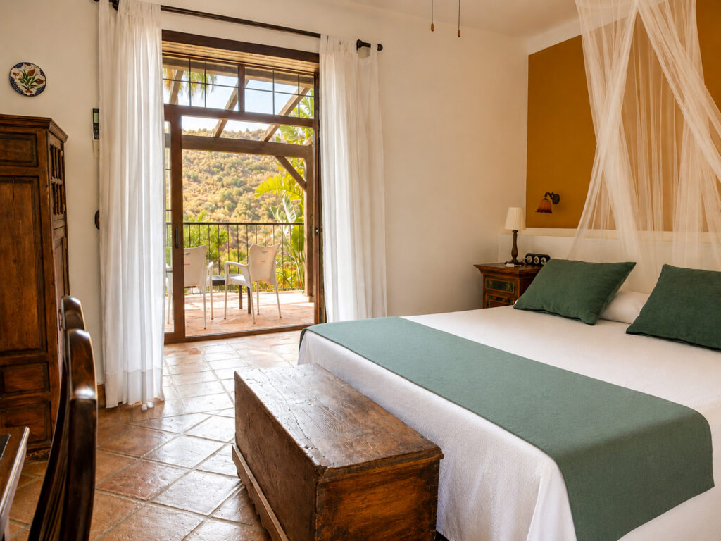 A double room at Santillan with doors on to the balcony